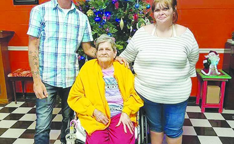 Matthew Trim, Linda Trim and Alisha Weaver smile together. Linda Trim died at Putnam Community Medical Center due to complications of COVID-19.