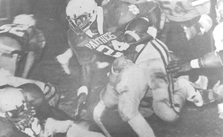 Palatka High School’s Jimmy O’Neal goes for yards in the team’s state tournament opening-round victory at home against Jacksonville Lee in 1982. (Daily News file photo)