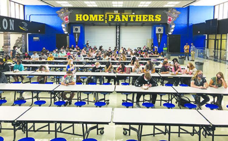 Palatka High School students social distance while eating lunch on the first day of school Monday. Putnam County School District officials have put in extra effort to ensure students and staff remain safe in school amid the coronavirus pandemic.