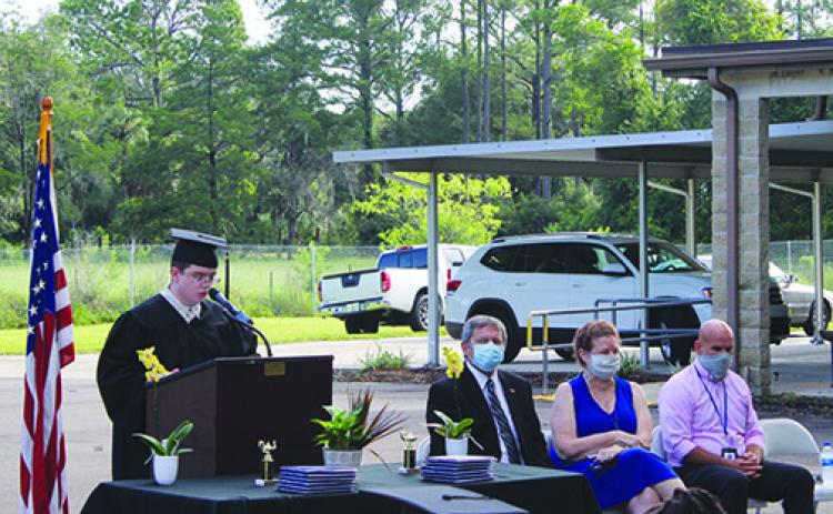 Ansley Hall delivers the keynote speech during E.H. Miller’s graduation ceremony Thursday morning honoring the school’s 12 graduates.