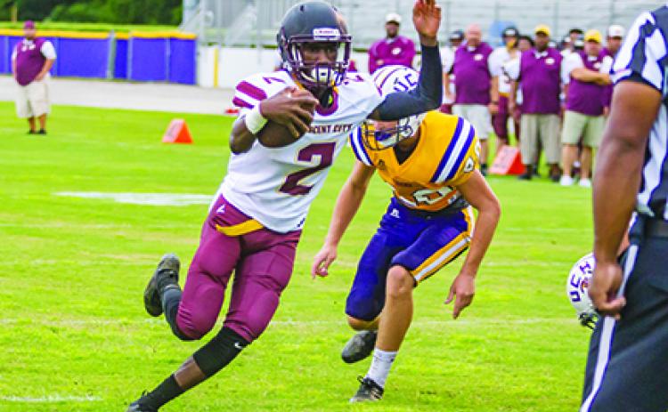 Crescent City senior Naykee Scott (2) keeps the ball and rambles across the goal line in the first quarter for the Raiders second score in a preseason game against Union County last August. 