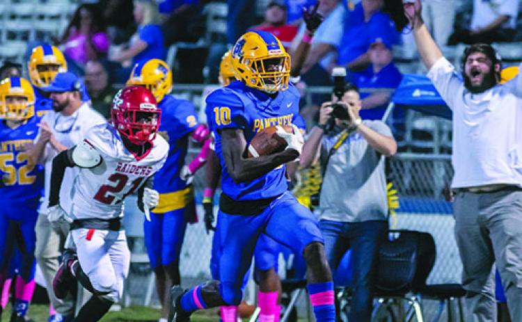 Palatka’s Malik Beauford heads for the end zone in a game last year against Santa Fe. Fans at high school football games this fall will be required to have masks to enter and to maintain social distancing because of COVID-19.