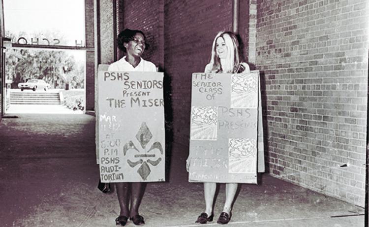 Palatka South High School students hold signs advertising a school play in 1970. The seniors of the 1969-1970 school year made up the first integrated class of graduates in the district.