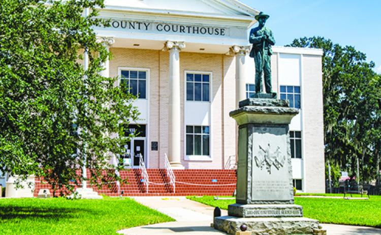 The Confederate monument stands outside the entrance to the Putnam County Courthouse.