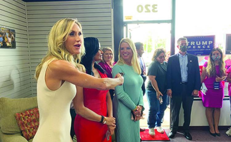 From left, Lara Trump, Katrina Pierson and Pam Bondi greet a crowd of about 75 people at the Putnam County Republican Party headquarters Wednesday afternoon for the Woman for Trump Bus Tour.