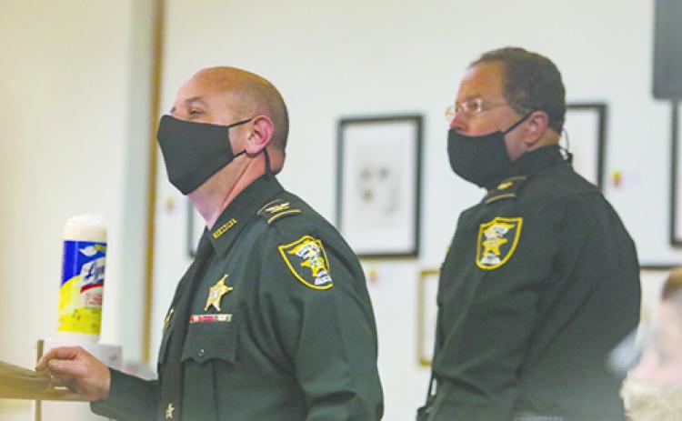 Putnam County Sheriff’s Office Col. Joe Wells, left, gives a presentation during last week’s Crescent City Commission meeting.