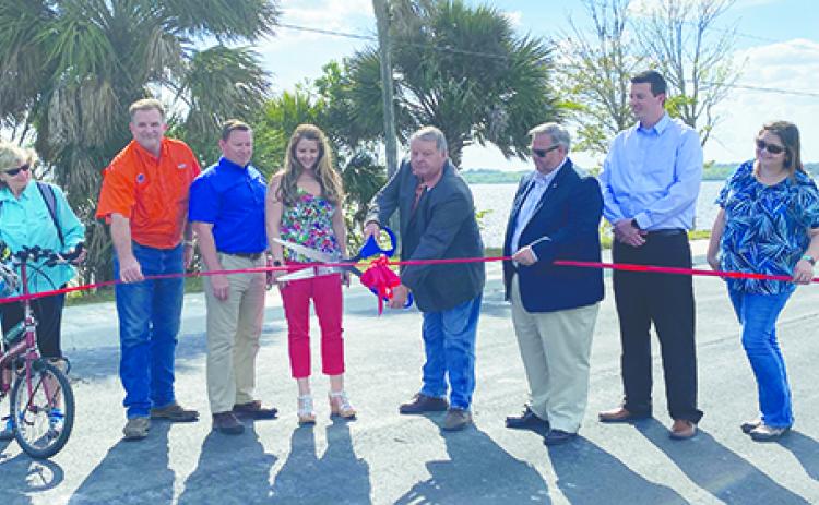 Putnam County officials celebrate the reopening of Veterans Memorial Park in East Palatka earlier this year.