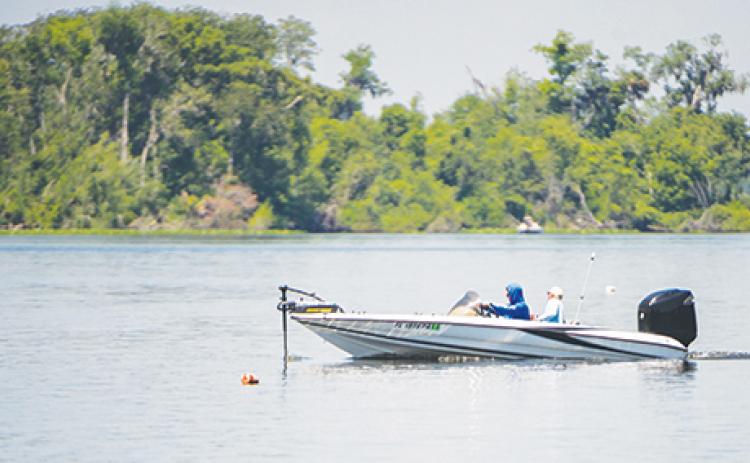 Anglers look for places to catch bass off of Brown’s Landing during the 2019 Wolfson Children’s Bass Tournament.