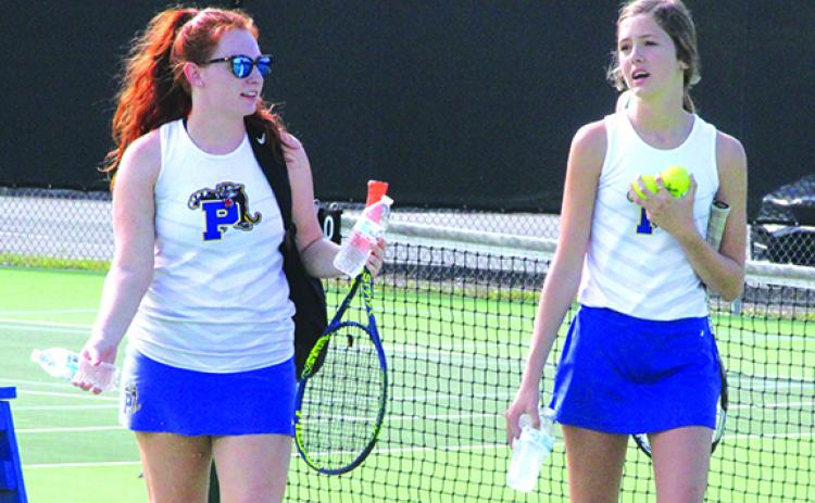 Lillian Maxwell (left) and Ruby Doran walk off the court after losing their District 5-2A first doubles semifinal Wednesday. (ANTHONY RICAHRDS / Palatka Daily News)