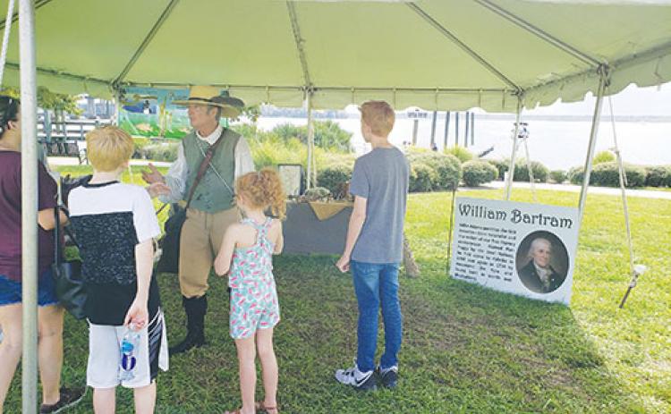 William Bartram, portrayed by Mike Adams, tells visitors at the 2019 St. Johns River Bartram Frolic about his adventures along the river.