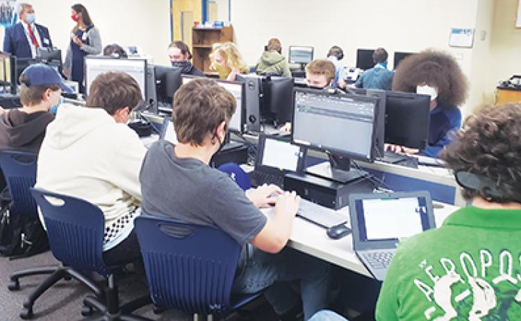 Students at Q.I. Roberts Junior-Senior High School participate in an artificial intelligence workshop.