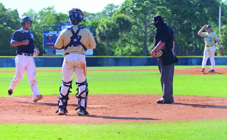 Ramses Cordova reaches home plate after hitting a game-tying, two-run home run against Seminole State in Game 3 of the best-of-3 Mid-Florida Conference series on Sunday. (MARK BLUMENTHAL / Palatka Daily News)