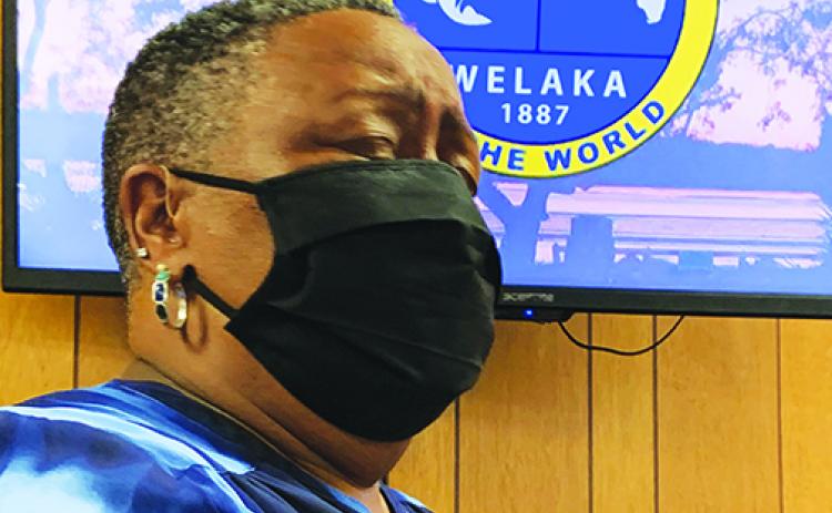 Kathy Washington reacts to being named the successor of the Welaka Town Council seat occupied by her father at the time of his death. She was appointed Tuesday evening during a council meeting.