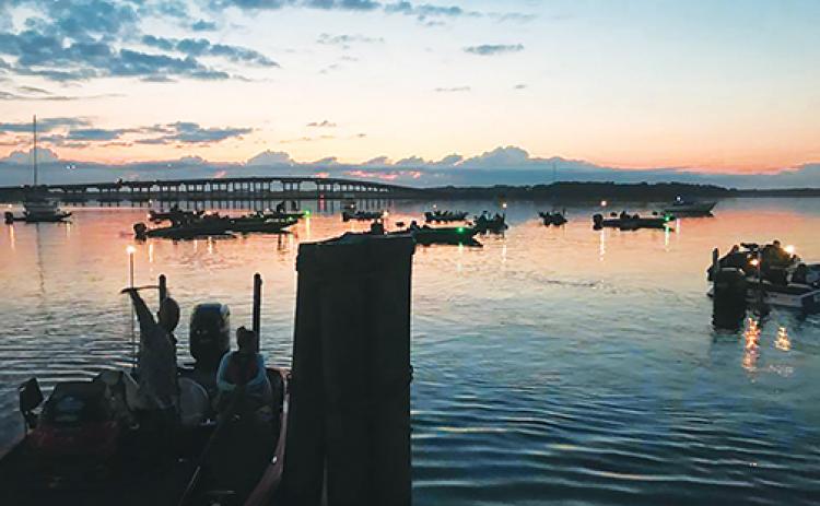 Boaters get ready to take off at safe light with Memorial Bridge in the background during a previous Wolfson Children’s Hospital Bass Tournament. The tournament returns to the Palatka riverfront Saturday with two lead-up events occurring Thursday and Friday.