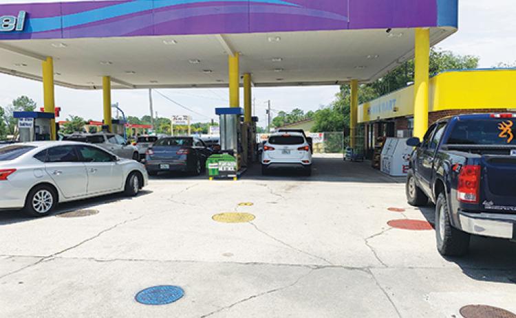 Vehicles pack the fuel pumps at Hi-Way Mart on Tuesday partially due to what officials say is panic-buying related to the hacked Colonial Pipeline, which in part supplies gasoline to the East Coast.