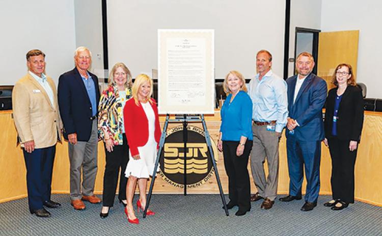 St. Johns River Water Management District governing board members proclaim next week Water Reuse week during a board meeting Tuesday.