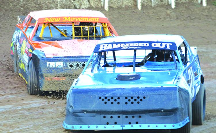 John Thorpe (in the car behind) tries to chase down Henry Lanier Jr. in the V8 Thunder Stocks class in hot laps racing. (ANTHONY RICHARDS / Palatka Daily News)
