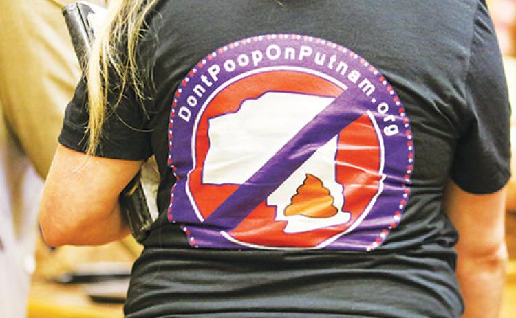 South Putnam residents wear “Don’t Poop on Putnam” shirts to a Board of County Commissioners meeting Tuesday to advocate not dumping biosolids near residential property.