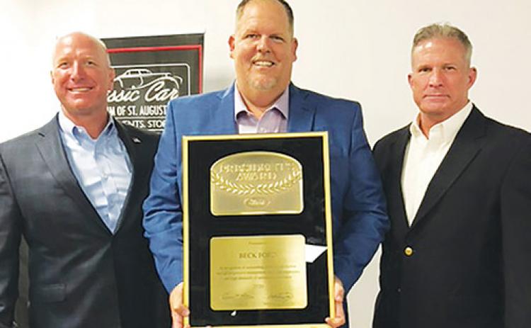 From left, Beck Automotive President Breck Sloan, Beck Ford General Manager Brian Freeman and Beck Chief Financial Officer Brad Sloan hold the Ford Motor Co. 2020 President’s Award earlier this month.