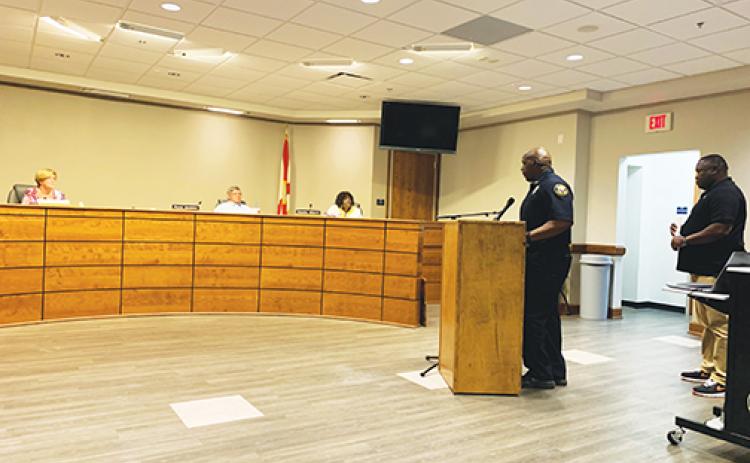 Palatka Police Department Chief Jason Shaw, accompanied by Mayor Terrill Hill, speaks to members of the Putnam County School District board about the importance of not letting Jenkins Middle School become a vacant facility.