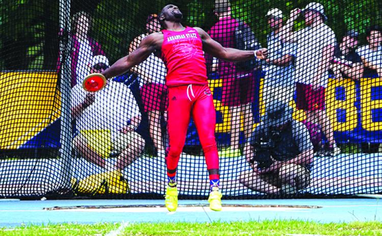 Former Palatka High School state champion and current Arkansas State junior Eron Carter throws the discus during a regular-season event. (Submitted photo)
