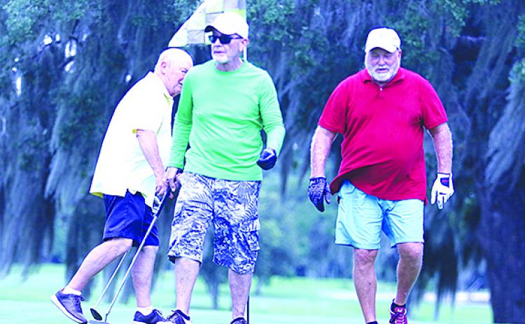 Don Kirby, John Anderson and Steve George walk off the sixth green during a round of golf at Palatka Golf Club on Tuesday. Golf.com recently ranked the course as the 29th best municipal golf course in the country.