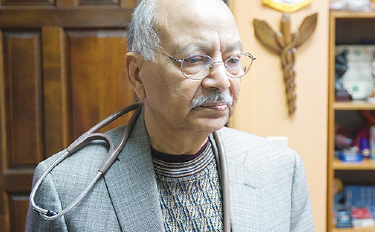 Dr. Iftikhar Ahmad stands in his office days before he entered retirement in 2018.