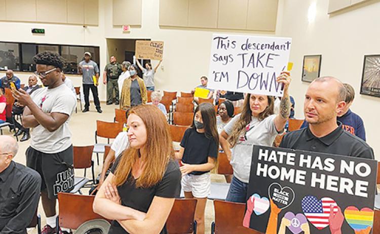 People eager to voice their opinions about a proposed ordinance to preserve historical monuments, including the controversial Confederate statue at the Putnam County Courthouse, gather inside the county commissioners’ meeting chambers Tuesday afternoon. 