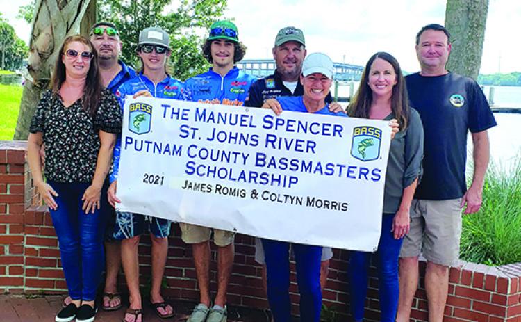 The Putnam County Bassmasters presented $1,000 scholarships to James D. Romig and Coltyn Morris on Friday to help them with expenses in next week’s Bassmaster High School Series National Championship in Tennessee. From left, are Julie Romig, James C. Romig, James D. Romig, Morris, Bassmaster Elite Series pro Cliff Prince of Palatka, Kelley Prince, Ashley Spencer and Coy Spencer. The scholarship is named for Coy Spencer’s father, Manuel Spencer. (WAYNE SMITH / Palatka Daily News)