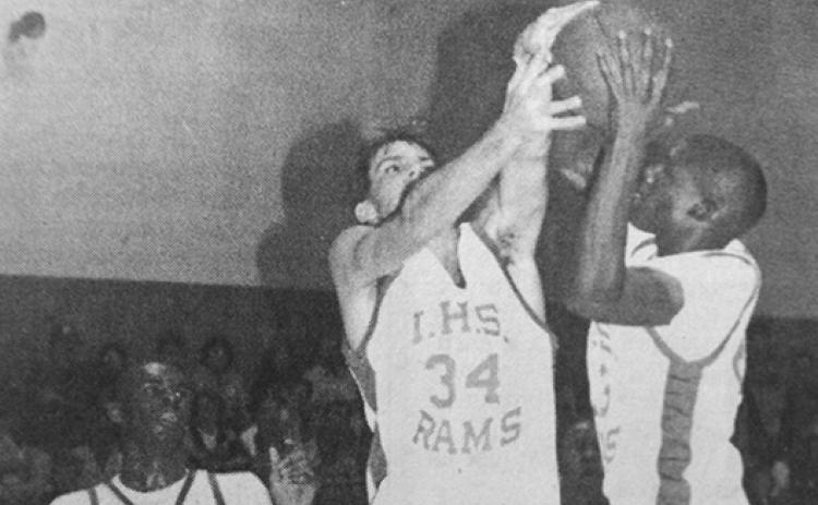 Interlachen’s duo of Dustin Rollins (middle) and Elias Armstrong go up for a rebound, while Mike Reed watches in the background in a Feb. 7, 1991 game against Clay. (Daily News file photo)
