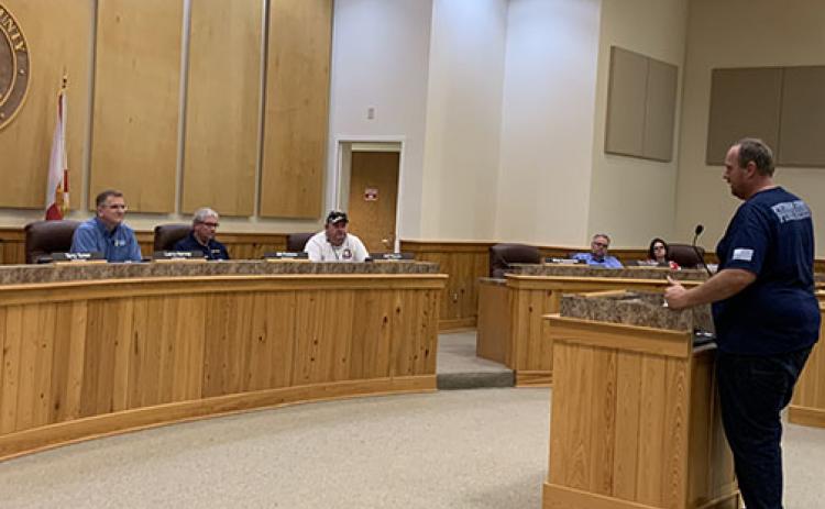 Putnam County commissioners listen to Executive Director of Public Safety J.R. Grimes, right, outline the county’s mobilization plan for Hurricane Elsa.
