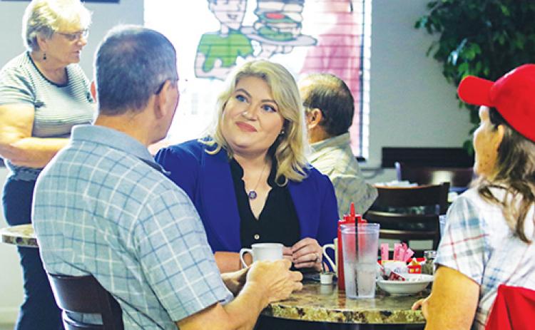 U.S. Rep. Kat Cammack, R-Fla., sits down with Putnam County residents at C P Deli & More in Palatka to listen to their concerns Tuesday morning.