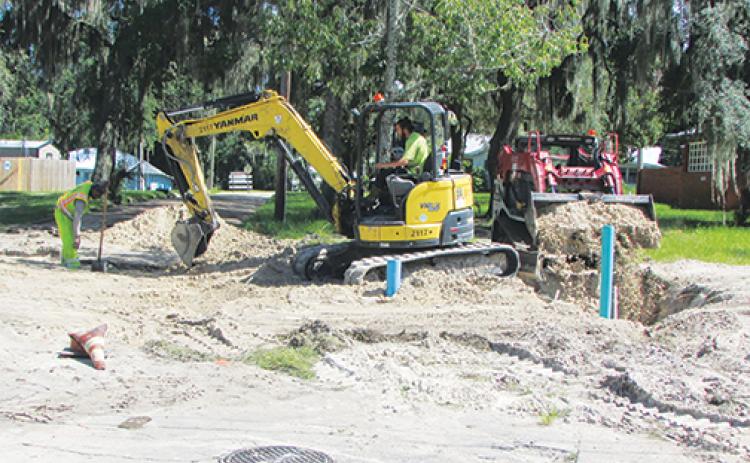 Workers with TB Landmark Construction get ready to place new water lines Wednesday at the intersection of 18th and Oak streets in Palatka as the city continues infrastructure upgrades.