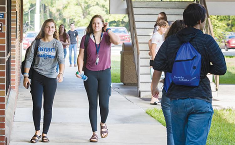 Students at St. Johns River State College make their way throughout the Palatka campus on the first day of the fall 2019 semester. The fall 2021 semester is slated to begin Monday.