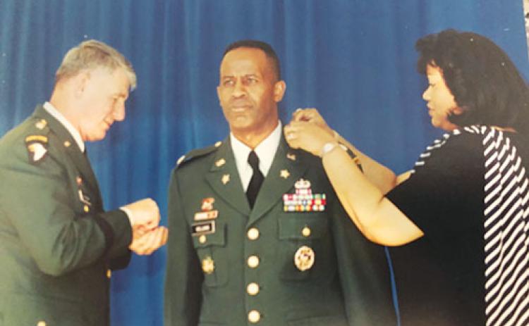 Darlene Williams pins her husband, Army Col. Thomas Williams, to signify his colonel rank with Maj. Gen. Robert Van Antwerp in attendance at the Pentagon in 2001 prior to the 9/11 attack.