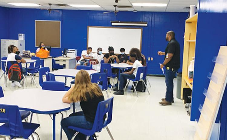 Palatka Junior-Senior High School students, most of whom are wearing masks, receive instruction Aug. 17, the first day of the academic year.