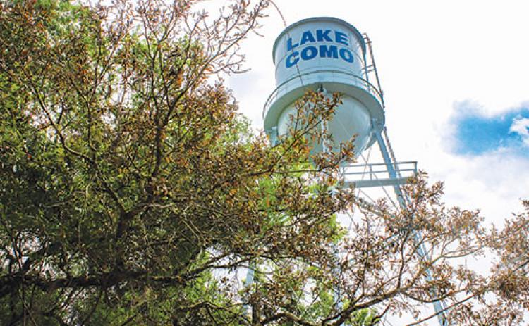 A water tower stands above the Lake Como Water Association headquarters in South Putnam.