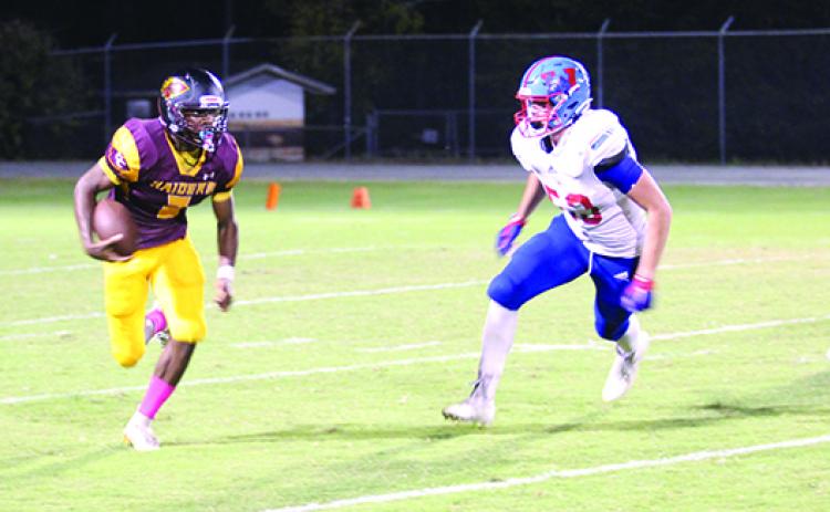 Crescent City quarterback Naykeem Scott (2) races to the outside as Wolfson’s Aiden Winslow tries to chase him down during Friday night’s game at Wisnoski Field at Wiltcher Stadium. (MARK BLUMENTHAL / Palatka Daily News)