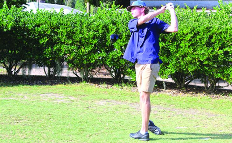 Palatka’s Cayden Annis watches his drive on the first hole in Monday’s District 4-2A tournament at the Palatka Municipal Golf Club. (MARK BLUMENTHAL / Palatka Daily News)