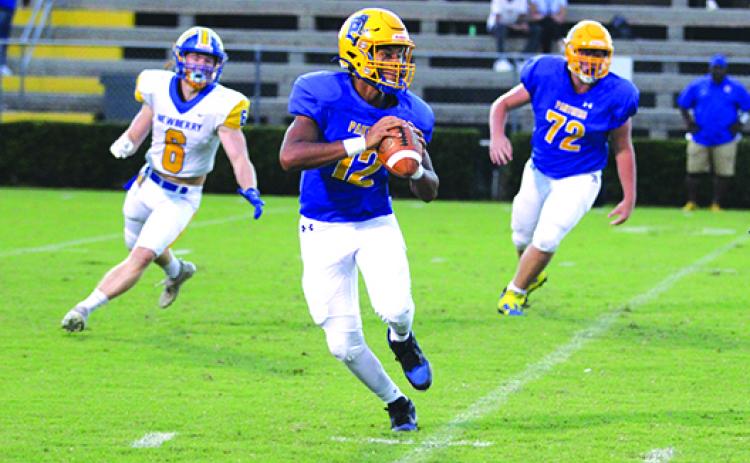 Palatka’s Jamarrie McKinnon, here looking for a receiver in a game last month against Newberry, threw for 119 yards and a touchdown in a loss to Gainesville Eastside last week. (MARK BLUMENTHAL / Palatka Daily News)