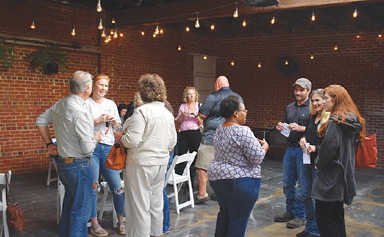 Local business officials mingle Thursday during the inaugural Putnam County Entrepreneur’s Social at Azalea City Brewing Co. in Palatka.