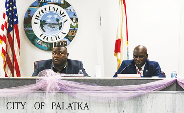 Palatka Mayor Terrill Hill, left, and Commissioner Rufus Borom discuss the Putnam County School District’s insistences that the city pay more money for the Jenkins Middle School building.