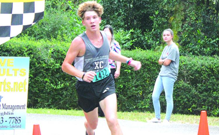Interlachen’s Tyler Price comes across the finish line to win the All-Putnam County boys championship on Oct. 6 at Ravine Gardens. He and his Rams teammtes will run Wednesday at Bishop Kenny High School in the District 2-2A championship. (MARK BLUMENTHAL / Palatka Daily News)
