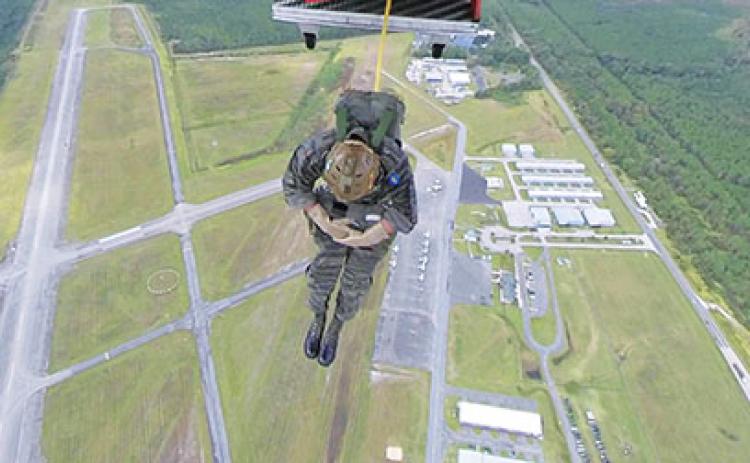Jumpmaster John Hoffstetter is the first person to exit the Casa 212 aircraft over Skydive Palatka at Kay Larkin field in Palatka.