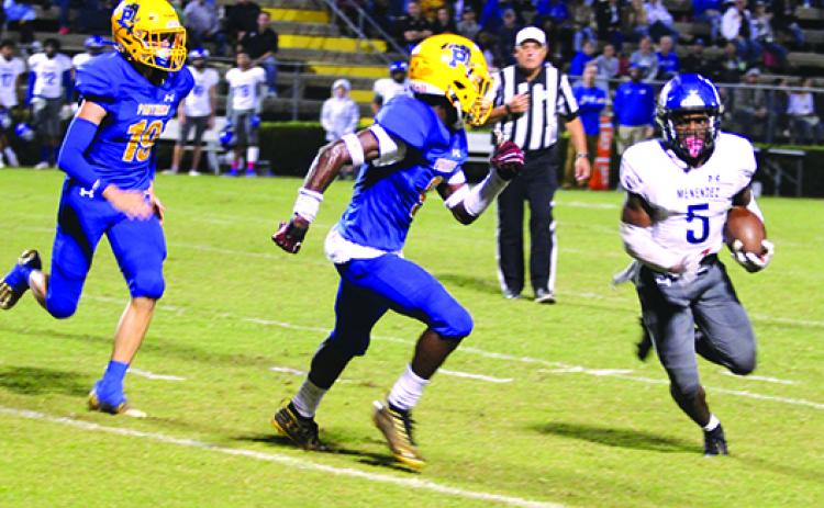 Menendez tailback Tabias Brown tries to elude Palatka defensive back Kamari Betts during their game last week. The Panthers conclude their season at arch-rival St. Augustine Friday. (MARK BLUMENTHAL / Palatka Daily News)  