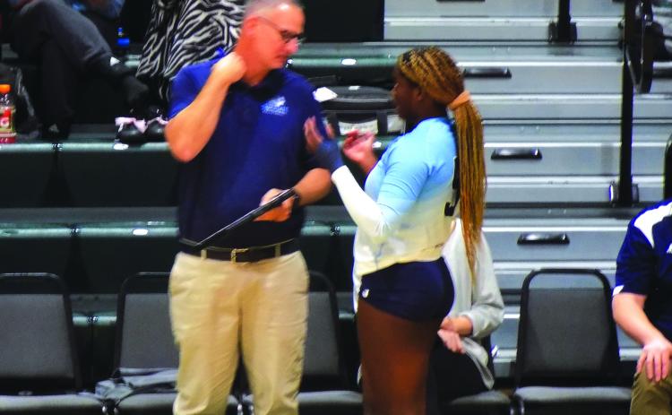 St. Johns River State College volleyball coach Matt Cohen (left) talks strategy with Kendall Hatchett during Thursday’s victory over Palm Beach State. (COREY DAVIS / Palatka Daily News)