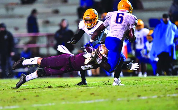 St. Augustine’s Patrick Stevens makes a lunging tackle attempt of Palatka ball carrier Leetrez Smith during Friday night’s game at Foots Brumley Stadium. (LOU MARINACCI / Special to the Daily News)