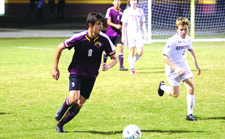 Crescent City David Newbold tries to bring the ball up against Jacksonville Episcopal’s Alex Hillyard during the first half of Tuesday's night game. (MARK BLUMENTHAL / Palatka Daily News)