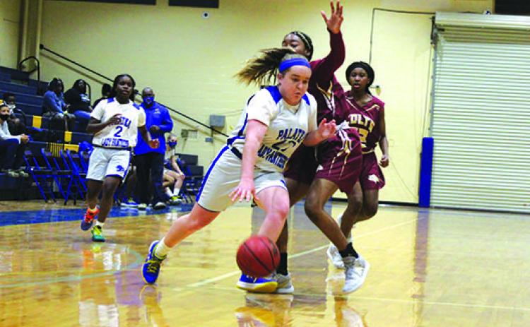 Palatka’s Samantha Clark (dribbling) and Zyria Jones (2) are two key players coach Craig Washington (below) hopes to rely on this season. (MARK BLUMENTHAL/Palatka Daily News)