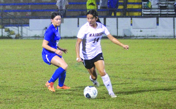 Crescent City’s Miriam Ocampo tries to dribble the ball past Palatka’s Addison Nettles in the first half of Wednesday’s game. (MARK BLUMENTHAL / Palatka Daily News)